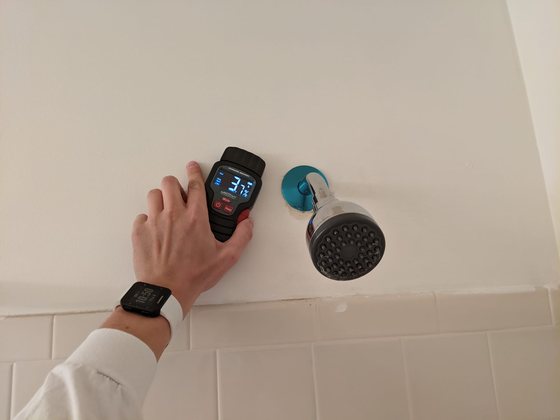 Inspector measuring moisture during a property assessment